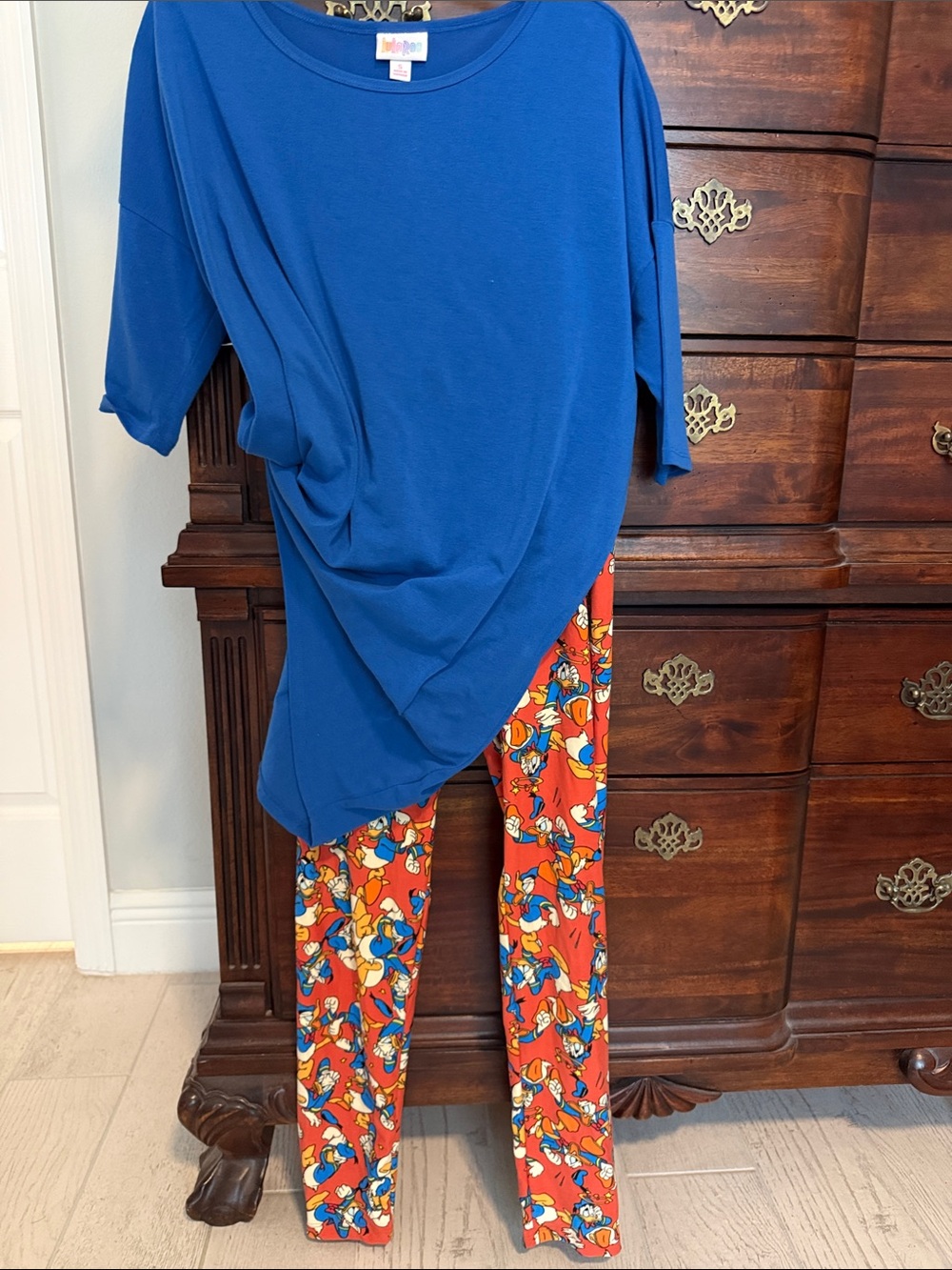LuLaRoe Blue Randy Top with orange Donald Duck leggings